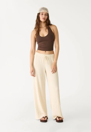 Брюки из рельефной струящейся ткани- Заказать в России