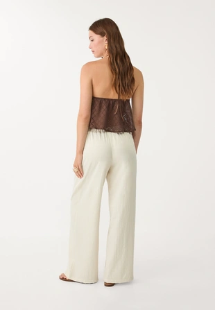 Брюки из рельефной ткани на шнурке- Заказать в России