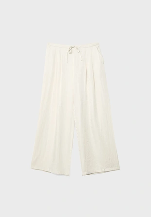 Брюки из рельефной ткани на шнурке- Заказать в России