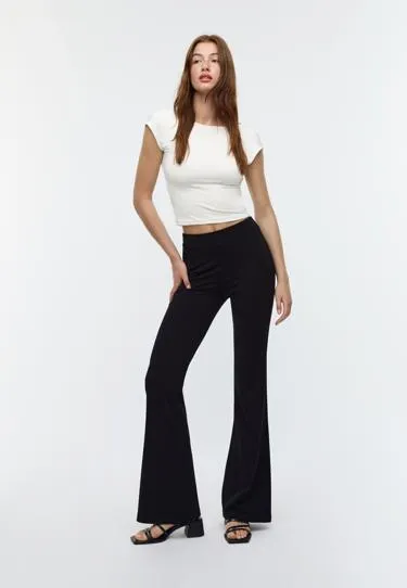 Брюки клеш из гладкого трикотажа- Заказать в России