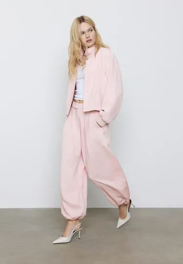 Брюки-шаровары с защипами и пряжкой