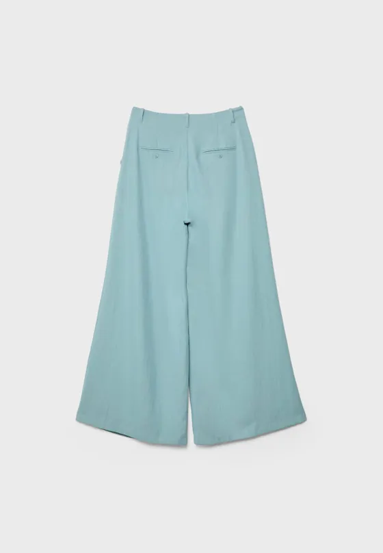 Брюки из струящейся рельефной ткани с защипами