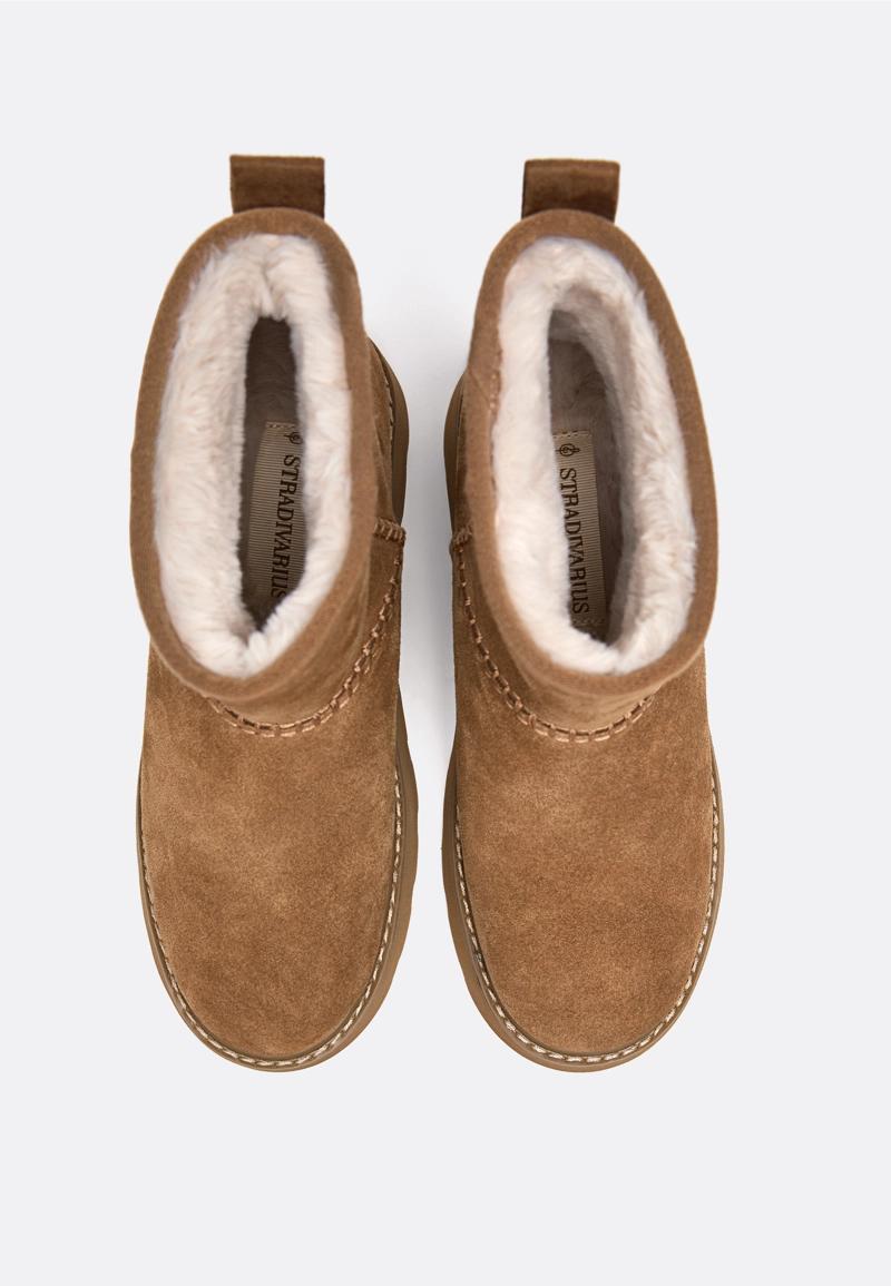 Ботинки из кожи на плоской подошве с меховой подкладкой