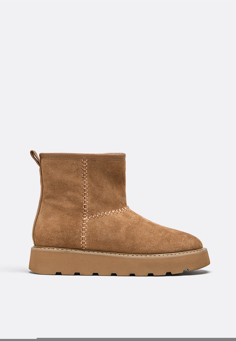 Ботинки из кожи на плоской подошве с меховой подкладкой