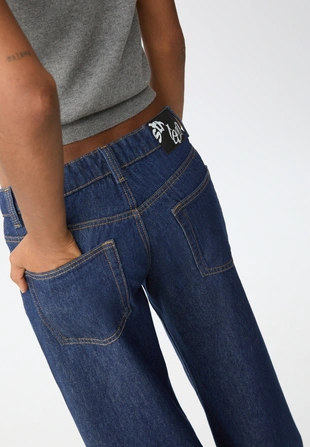 Джинсы-багги свободного кроя- Заказать в России