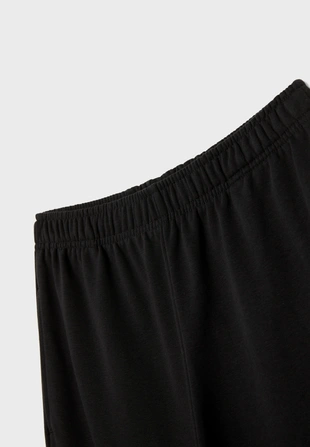 Брюки-джоггеры свободного кроя- Заказать в России