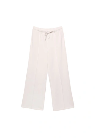 Брюки свободного кроя с мягкими нервами- Заказать в России