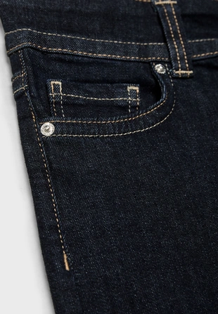 Джинсы клеш с низкой посадкой и двумя пуговицами- Заказать в России