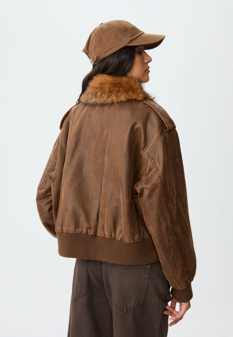 Укороченная комбинированная куртка из искусственного меха