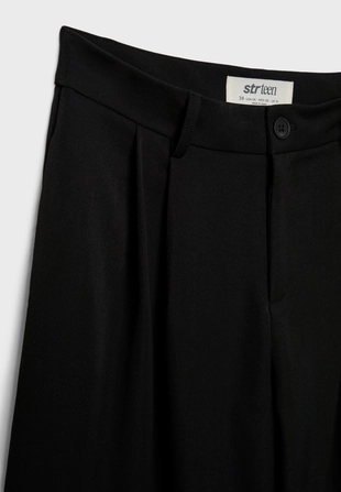 Классические брюки свободного кроя с защипами- Заказать в России