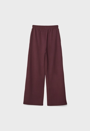 Брюки-джоггеры с эффектом потертости- Заказать в России