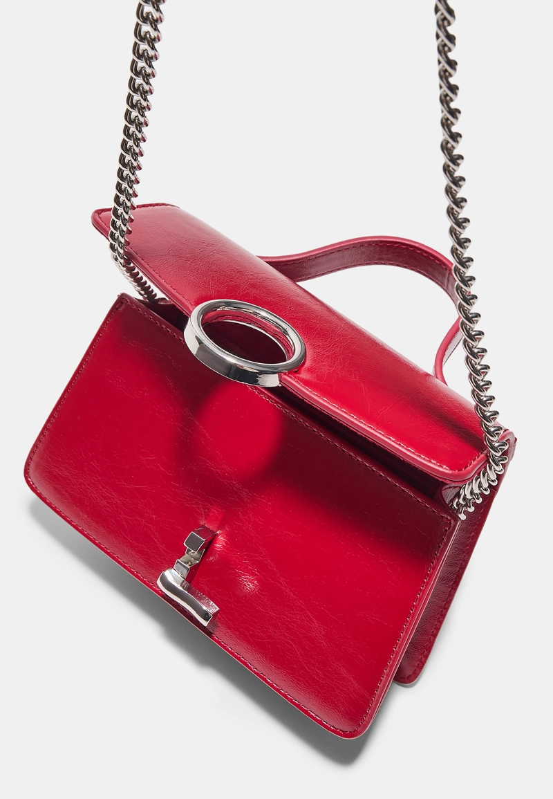 Сумка с плечевым ремнем и круглой застежкой