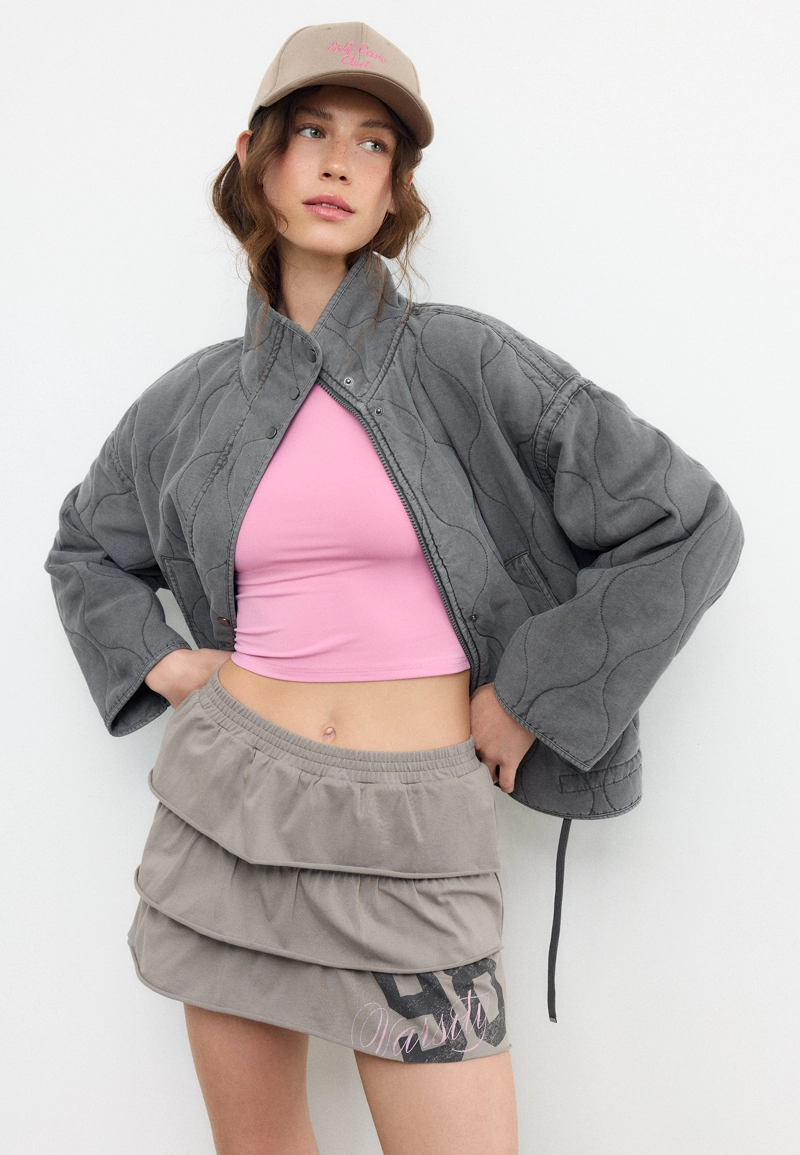 Мини-юбка с воланами и позиционным принтом