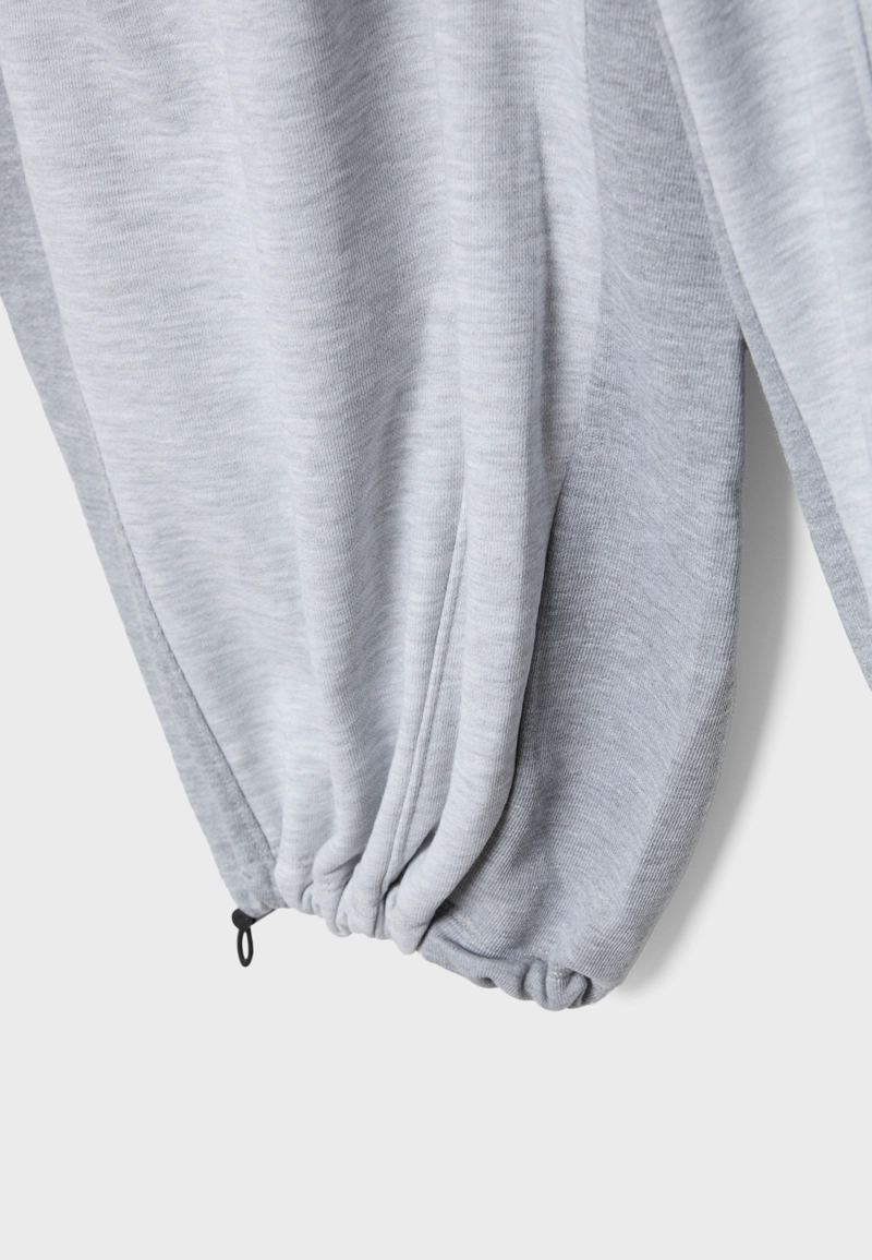 Брюки-джоггеры шароварного кроя со стопперами