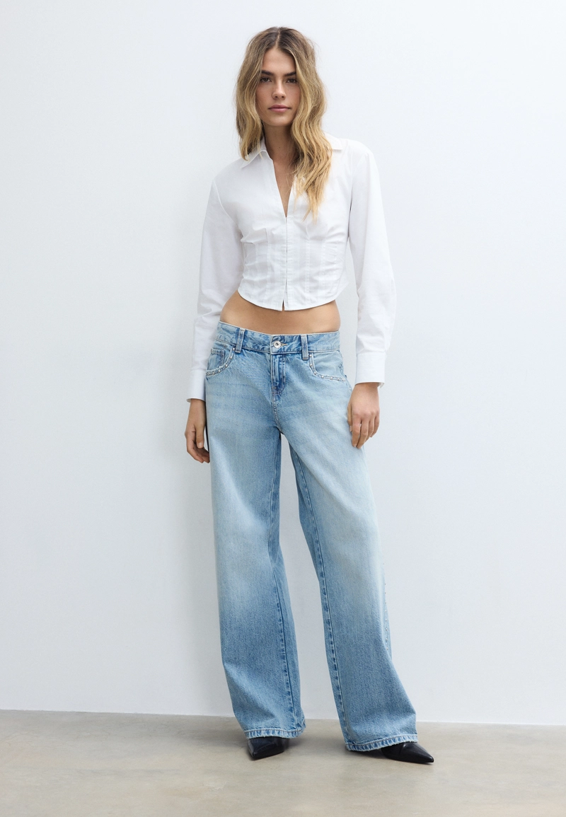 Джинсы свободного кроя с заклепками