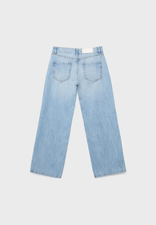 Джинсы свободного кроя с заклепками- Заказать в России