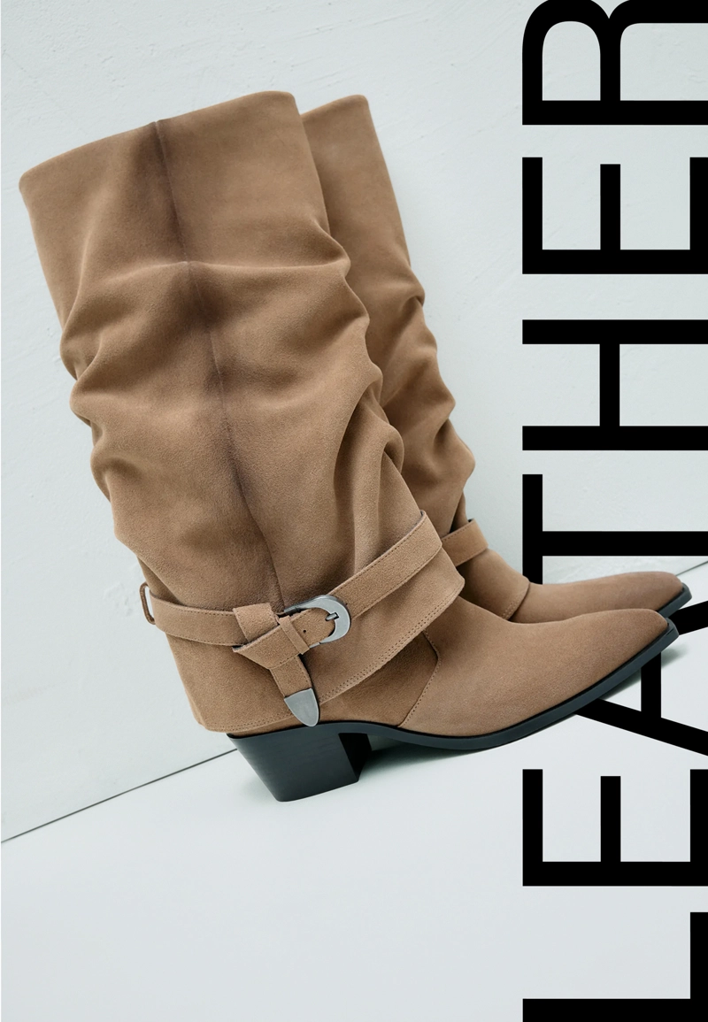 Кожаные сапоги-ботфорты на каблуке