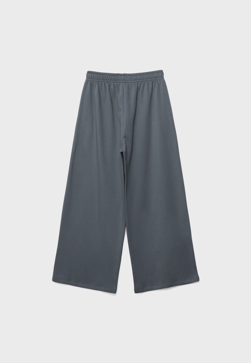 Брюки из футера с заклепками