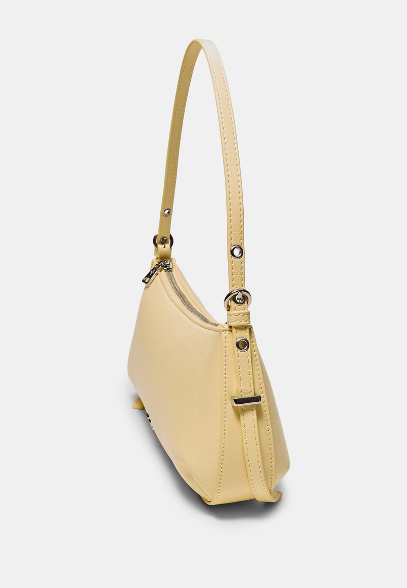 Удлиненная сумка на плечо с люверсами