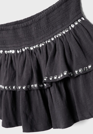 Мини-юбка с воланами и заклепками- Заказать в России