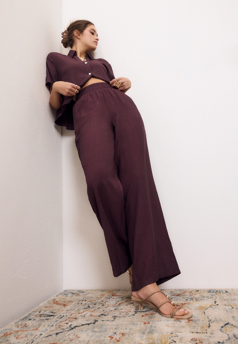 Брюки палаццо с широким поясом