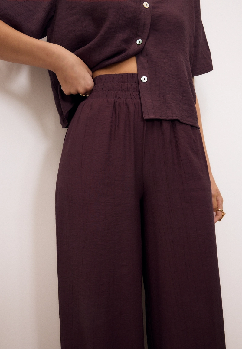 Брюки палаццо с широким поясом