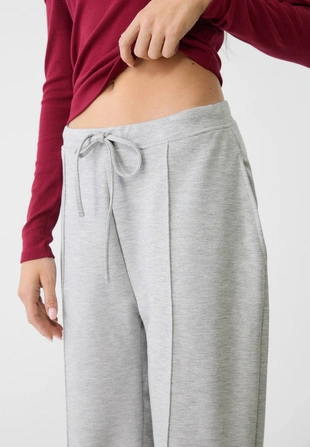 Мягкие джоггеры свободного кроя с отстрочкой- Заказать в России