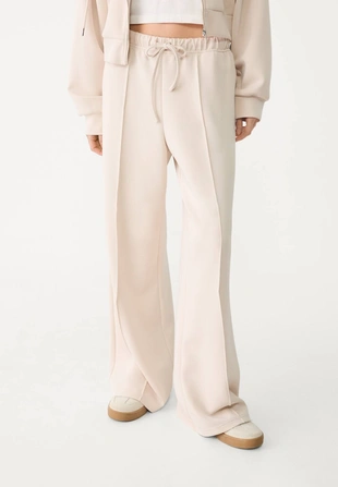 Мягкие джоггеры свободного кроя с отстрочкой- Заказать в России