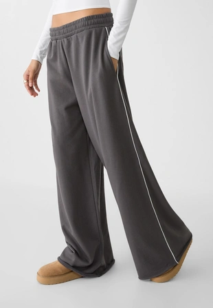 Брюки из мягкой ткани с широкими штанинами и окантовкой- Заказать в России