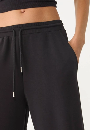 Брюки-джоггеры палаццо, мягкие на ощупь- Заказать в России