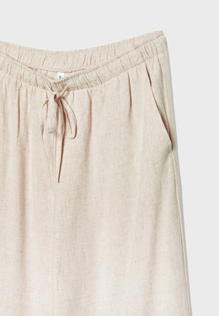 Брюки свободного кроя из смесового льна- Заказать в России